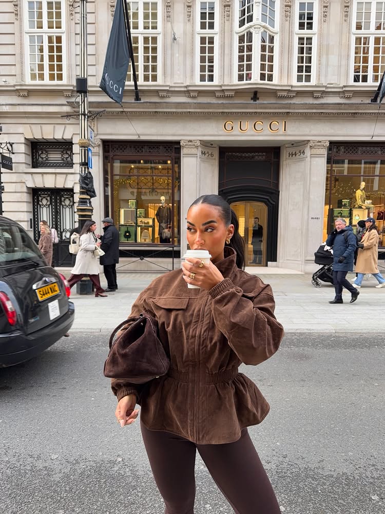 Instagram post by @osullliv for PrettyLittleThing. Caption reads: powered by caffeine & good outfits 🤝🏾....