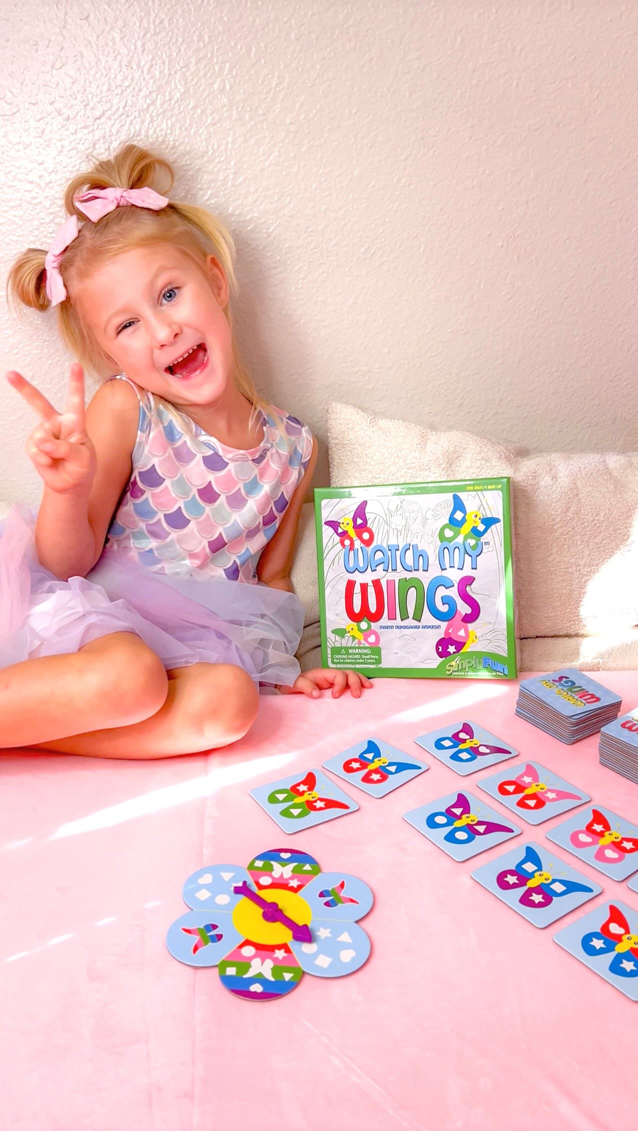 Instagram post by @idkivy for SimplyFun. Caption reads: [...] fun & learning with Watch my wings by....