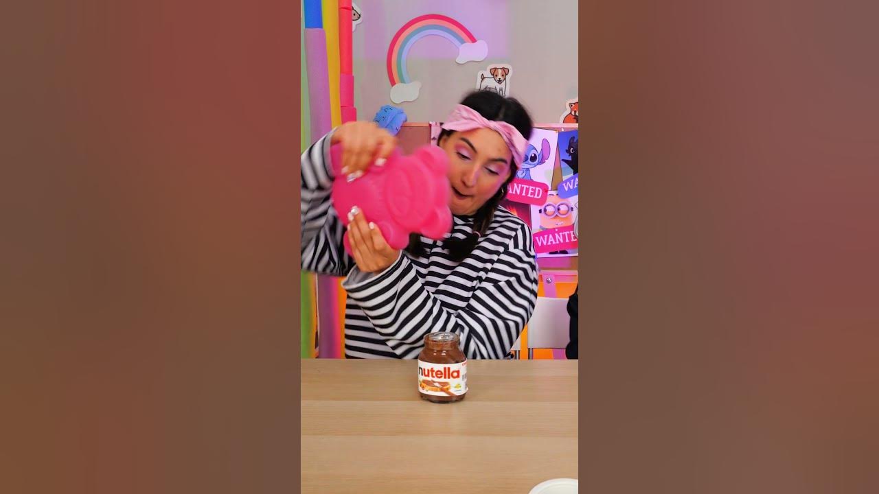 YouTube post by @Fizzle_Wop for Envato. Caption reads: ❓NEED MORE NUTELLA? YES — ALL OF IT! 🍫😄 #shorts....