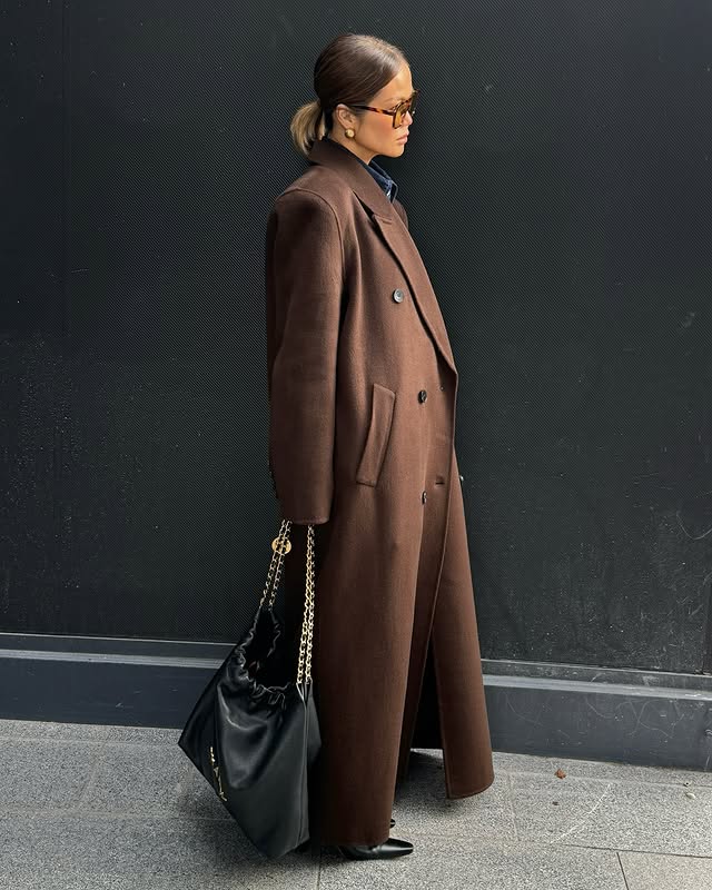 Instagram post by @lucky_girl_h for SSENSE. Caption reads: [...] the best winter coat 🤎

Available at....