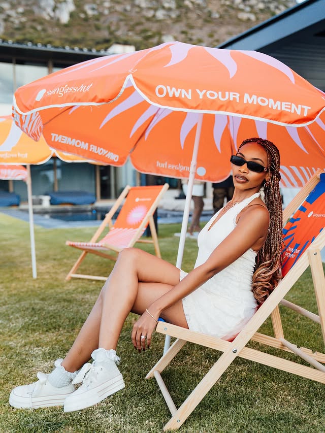 Instagram post by @shalatesekhabi for Sunglass Hut. Caption reads: #OwnYourMoment @sunglasshut ❤️‍🔥.