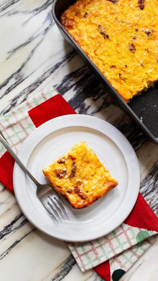 Instagram post by @modestmarce for The Kitchn. Caption reads: would like to wake up to this cheesy potato....