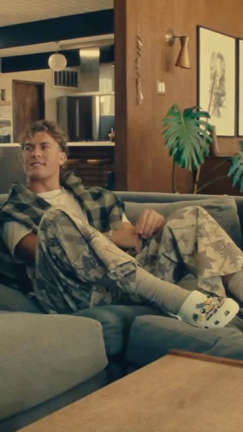 Instagram post by @jaxsondart for Crocs. Caption reads: Everywhere I go @crocs #CrocsPartner.