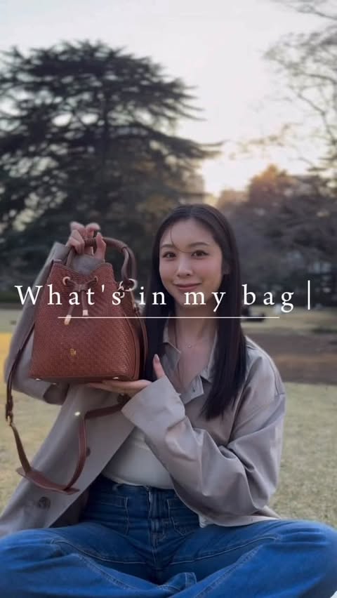 Instagram post by @chiaki_shimoyama for PARIS/64. Caption reads: What's in my bag?👜 bag @paris64world wallet....