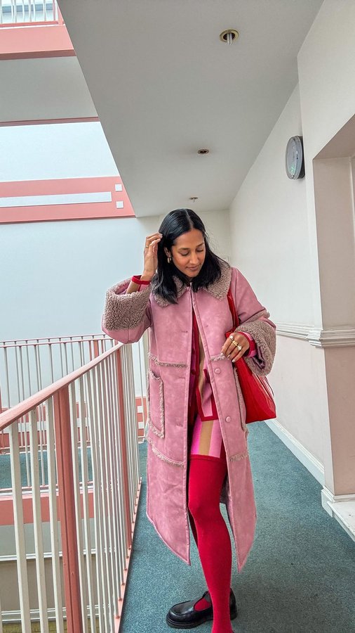 Instagram post by @heartzeena for Baum und Pferdgarten. Caption reads: [...] 

Striped perfection @rixo 
Coat....