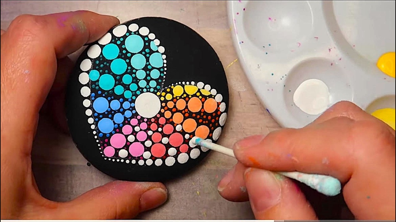YouTube post by @LydiaMay for DecoArt. Caption reads: EASY qtip rock painting | Lydia May.
