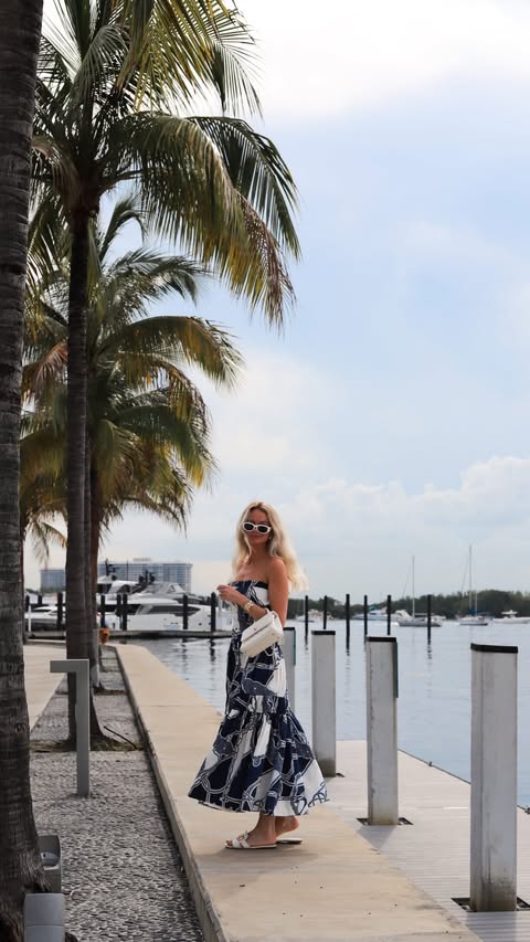 Instagram post by @vanilace for Karen Millen. Caption reads: A cute summer dress, ocean views, boats all....