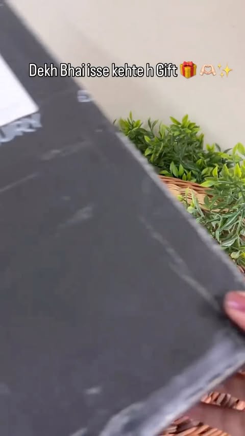 Instagram post by @thataugustgirl13 for GUESS. Caption reads: Gift 1 more unboxing coming.