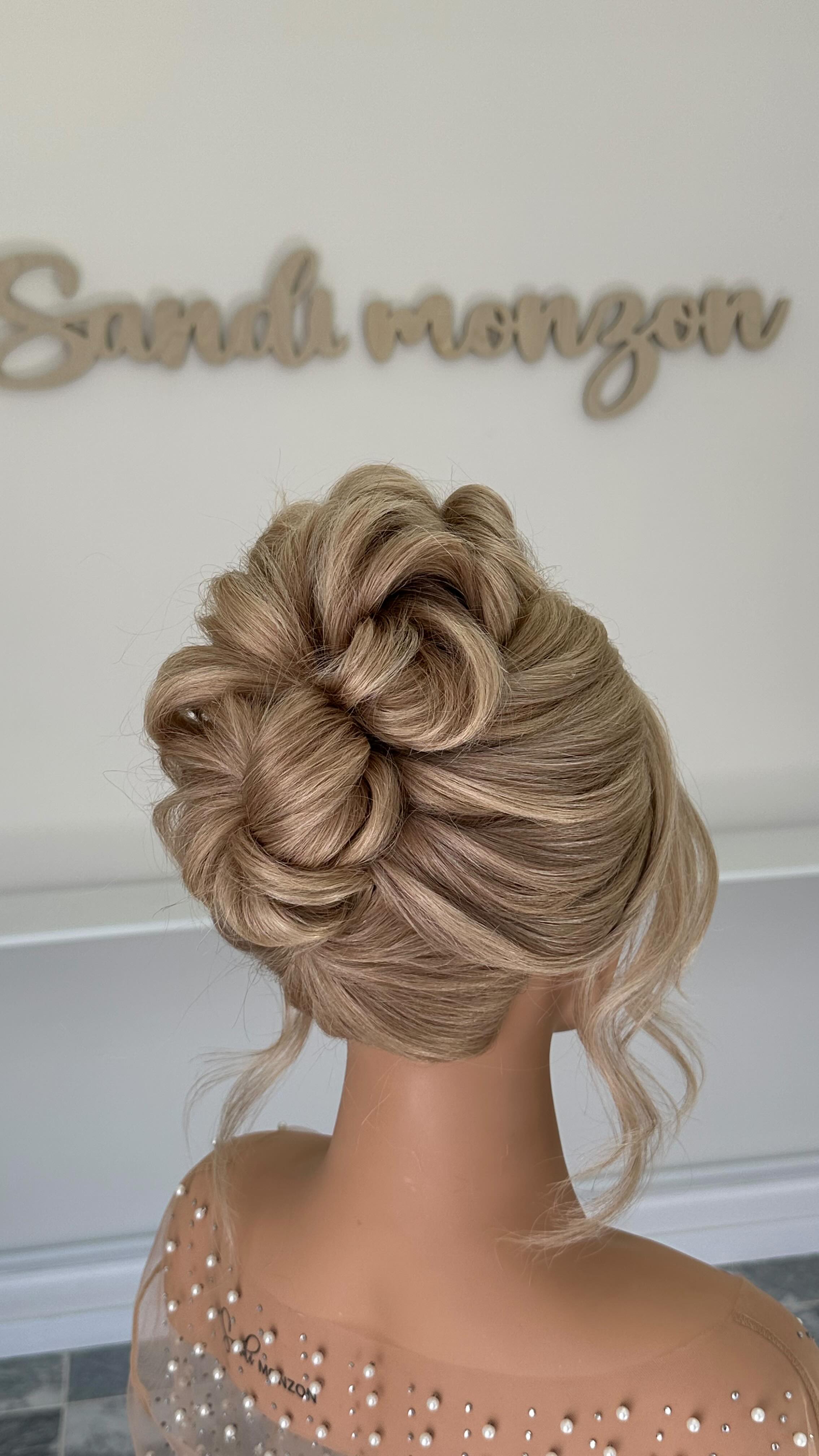 Instagram post by @sandimonzon for SalonCentric. Caption reads: Textured Updo Tutorial, in partnership with....