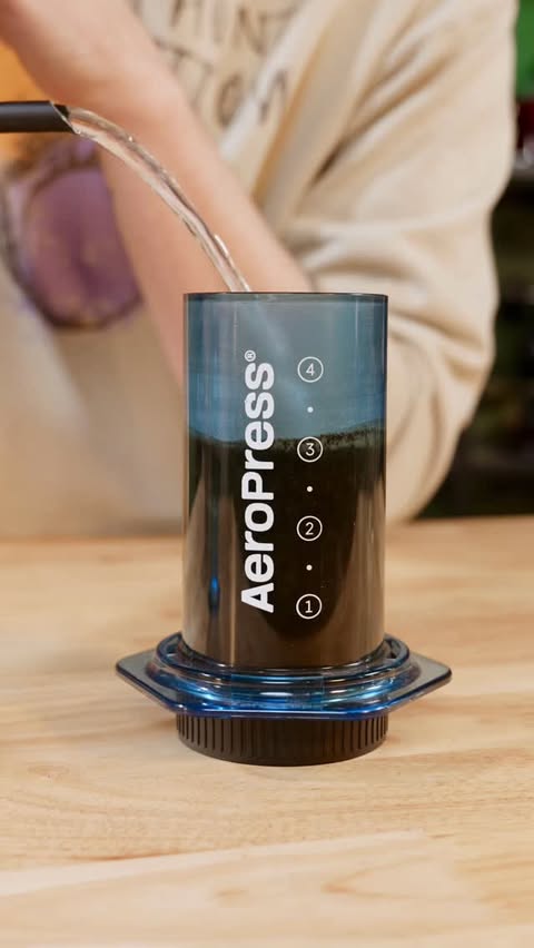 Instagram post by @softpourn for AeroPress. Caption reads: Here’s how to use an @aeropress If you need one,....