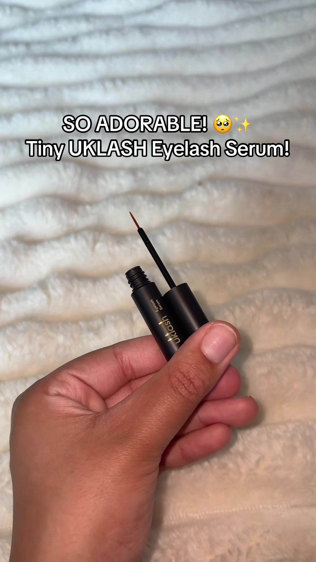 TikTok post by @thebeautysister_ for UKLASH. Caption reads: [...] walk for this eyelash serum! @UKLASH #uklash....