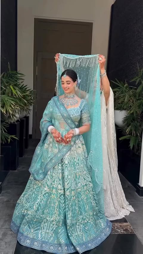 Instagram post by @weddingplzbrides for WeddingPlz.com. Caption reads: Blue became her statement, and Nandini made it....