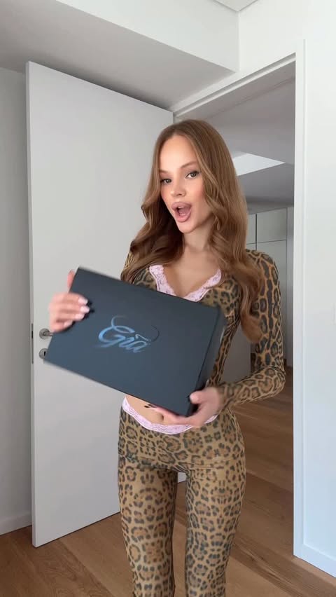 Instagram post by @fffetisova for IAMGIA. Caption reads: Get dressed with @iamgia 🐆💕.