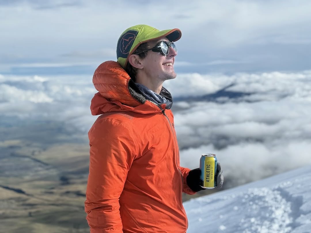 Instagram post by @tylercandrews for Athletic Brewing. Caption reads: Cheers to a fantastic block in Quito,....