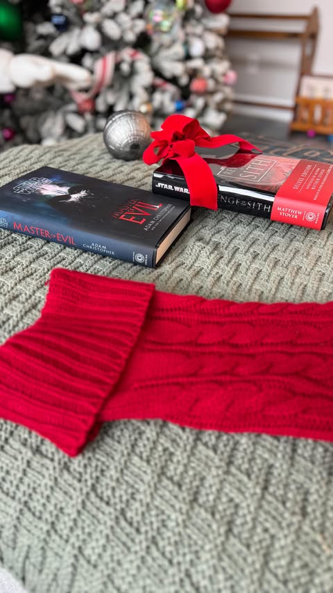 Instagram post by @ohhlanduh for Disney Publishing Worldwide. Caption reads: 📕 A warm holiday reading moment with a little....