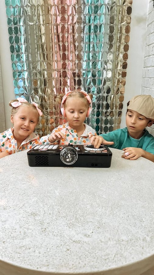 Instagram post by @the.becktriplets for VTech Toys USA. Caption reads: 🎉 Tripling the fun with our little DJs in the....