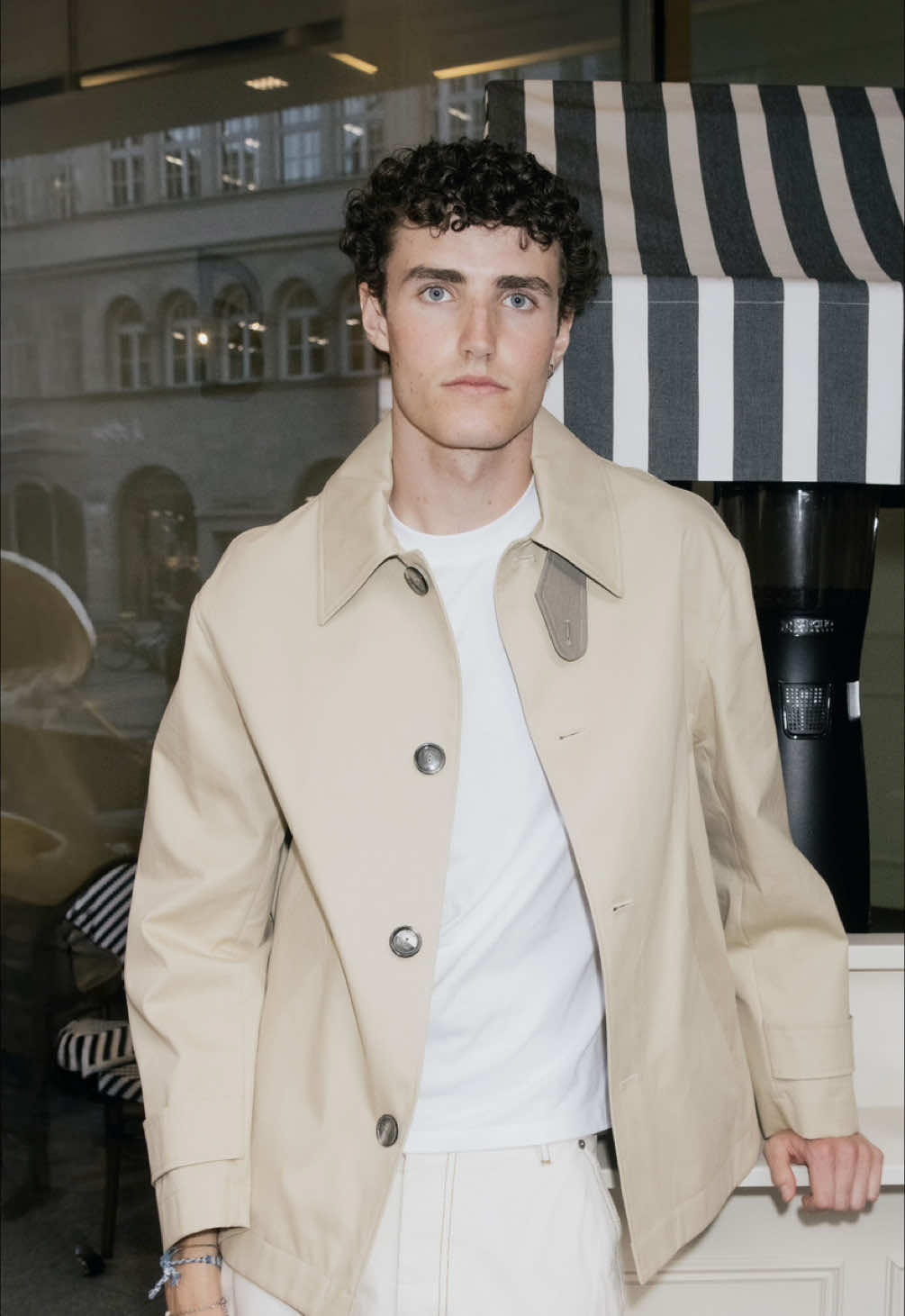 TikTok post by @breuninger for AMI Paris. Caption reads: [...] Breuninger, wearing the new @Ami Paris....