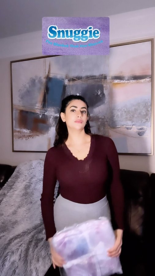 Instagram post by @sunainabhagi for Snuggie. Caption reads: Introducing @officialsnuggie 💜 THE BLANKET THAT....