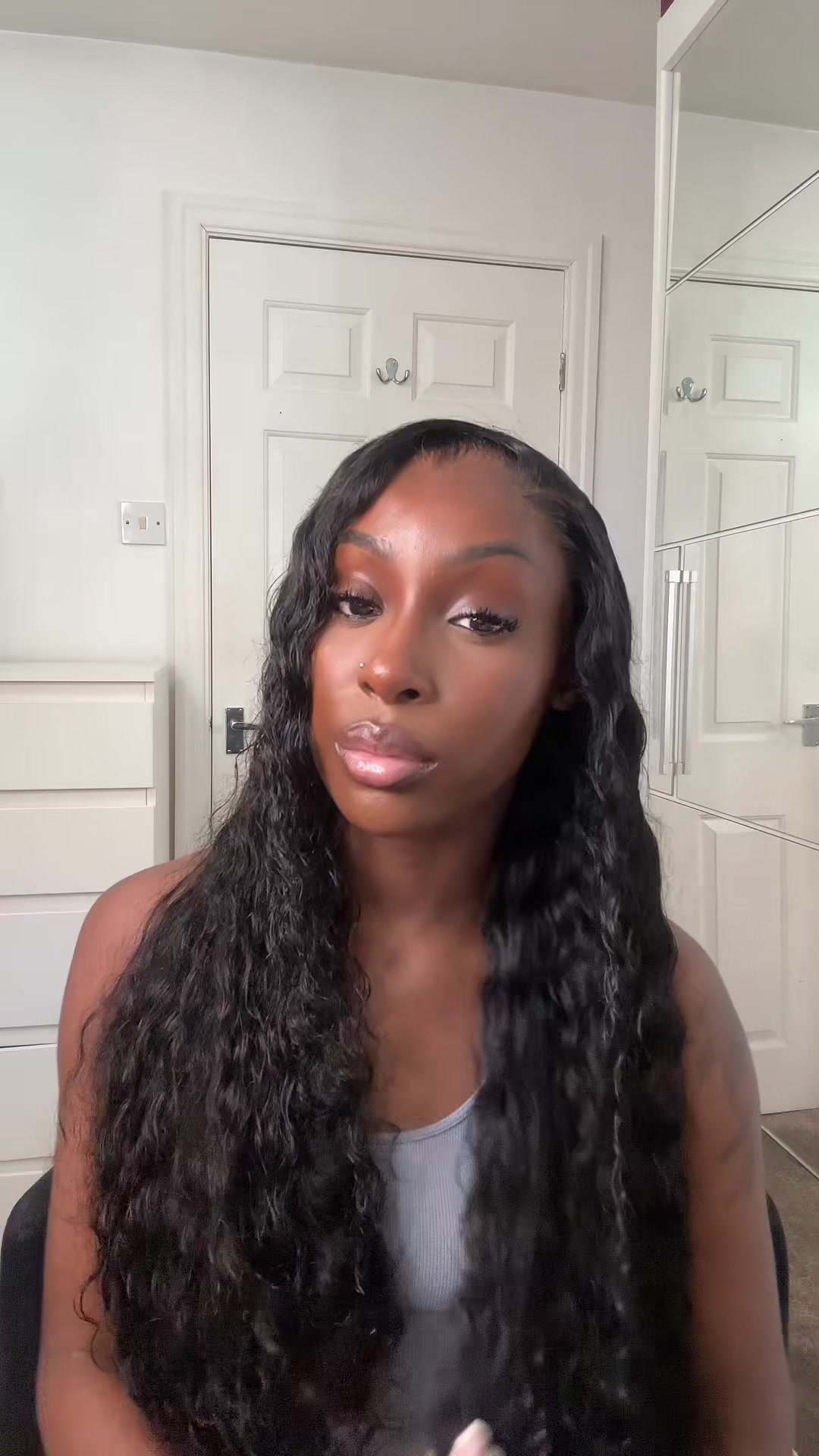 TikTok post by @denise.mb for Wiggins Hair. Caption reads: @wigginshairwig The best curly hair for summer!....