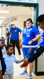 Instagram post by @coltscommunity for American Family Insurance. Caption reads: QB1 made a surprise visit at today’s School....