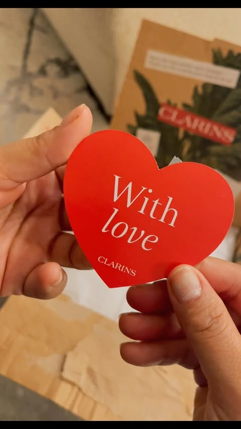Instagram post by @sanakhan_blog for Clarins. Caption reads: A little Clarins luxury has arrived 🤍 Unboxing my....