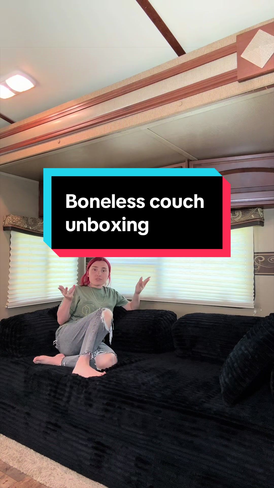 TikTok post by @_parisrenee_ for OVIOS OFFICIAL. Caption reads: Boneless couch unboxing for our camper renovation....