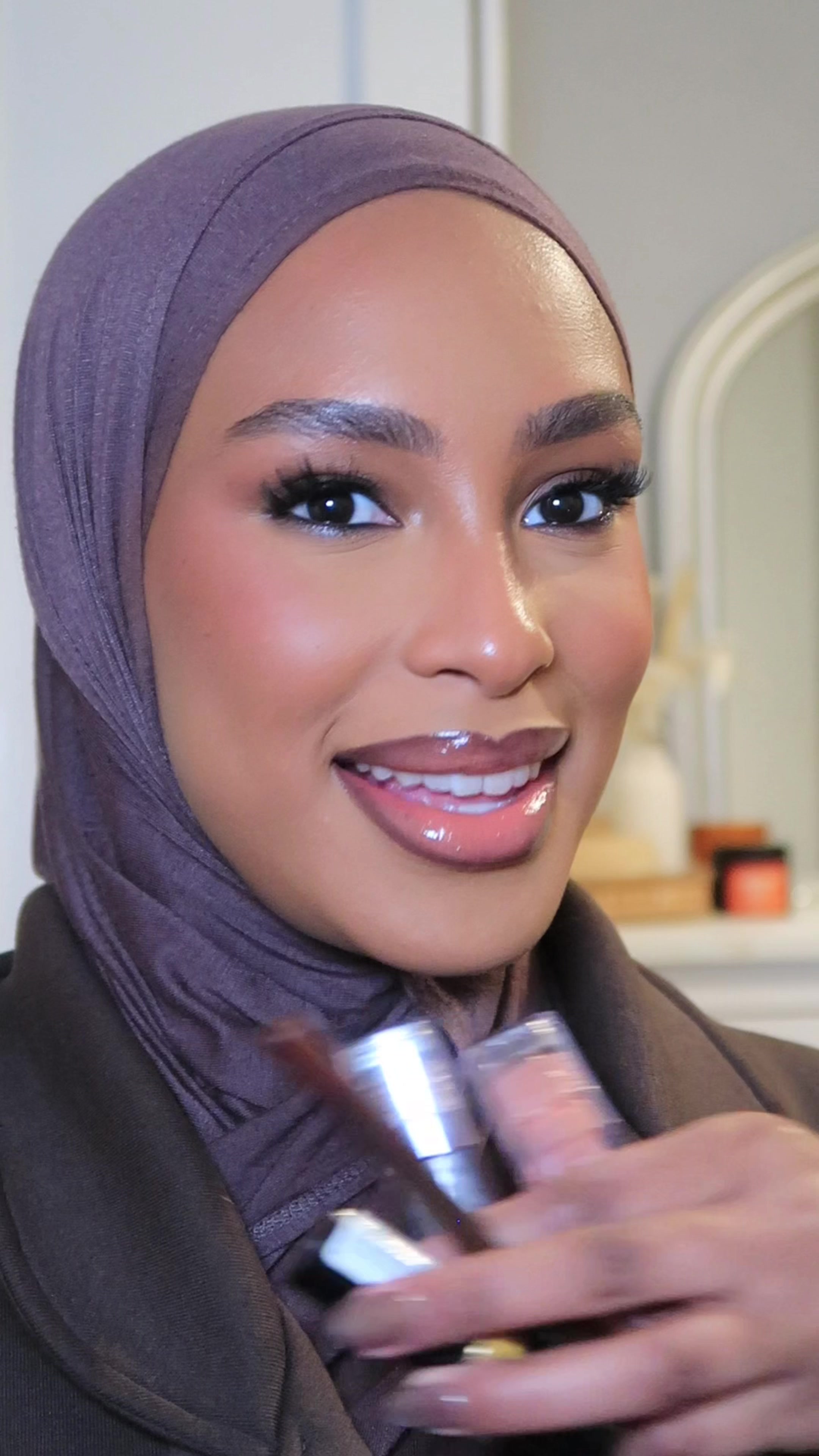 TikTok post by @drdiabb for Revlon. Caption reads: [...] -Rich brown  Faux FILLER gloss- coco & honey....