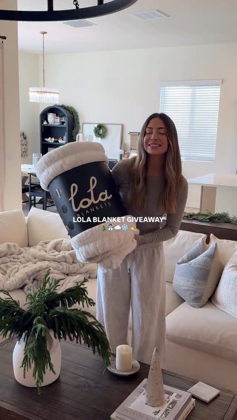 Instagram post by @nicolecarlsonxo for Lola Blankets. Caption reads: @lolablankets GIVEAWAY!!! ☃️❄️🤍 feeling in the....
