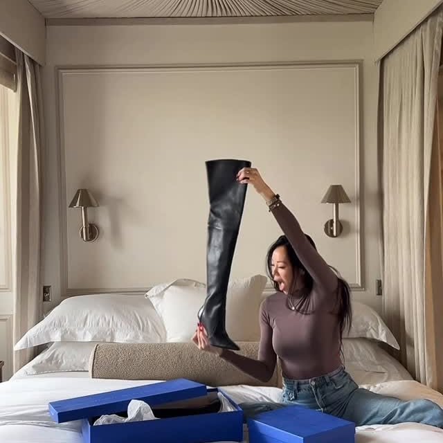 Instagram post by @dara_huang for STUART WEITZMAN. Caption reads: [...] mean you have to hang up the boots!....