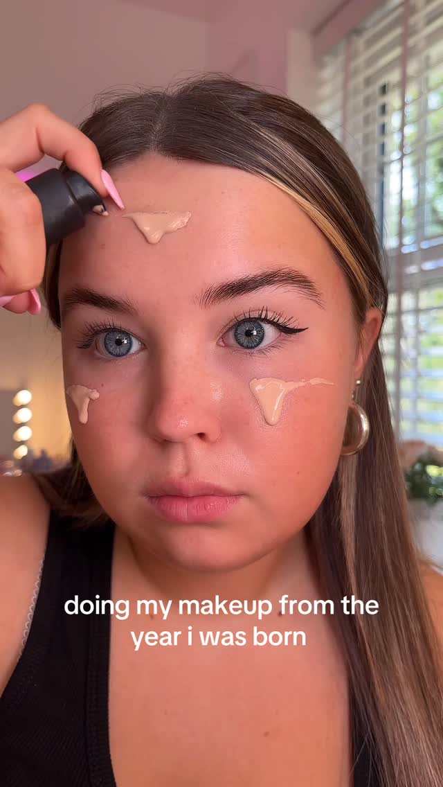 Instagram post by @makeupizzyy for Milani Cosmetics. Caption reads: doing my makeup from the year i was born… guess....