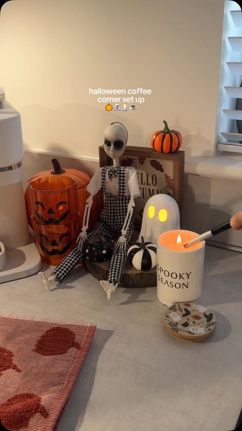Instagram post by @lifeatwellwood for The Range. Caption reads: a lil halloween coffee corner set up 🖤🎃👻☕️🕯️....