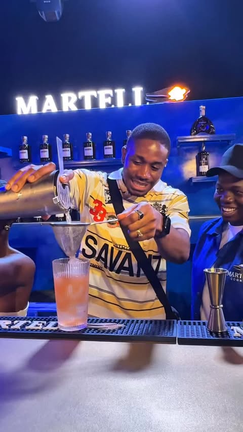 Instagram post by @ini_cash for Martell. Caption reads: MY FIRST TIME IN GHANA 🇬🇭 AND ITS WITH....