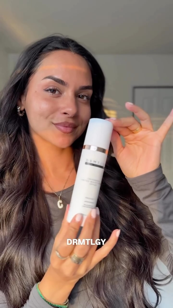 Instagram post by @clauuulynnn for DRMTLGY. Caption reads: makeup but make it SPF al summer long with....