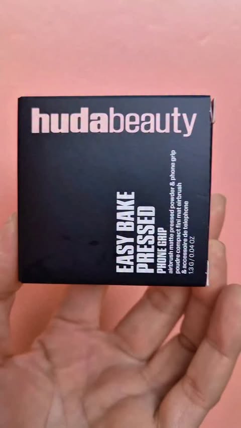 Instagram post by @mohni_world for HUDA BEAUTY. Caption reads: [...] obsession… now on my phone! 💕✨ Huda beauty....