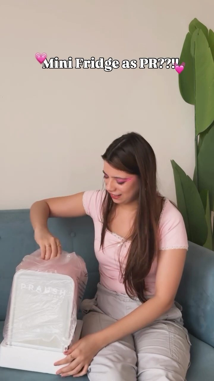 Instagram post by @mili_lakhmani for Praush Beauty. Caption reads: MINI FRIDGE AS PR!!?? 😭💕 @praush.beauty you’ve....