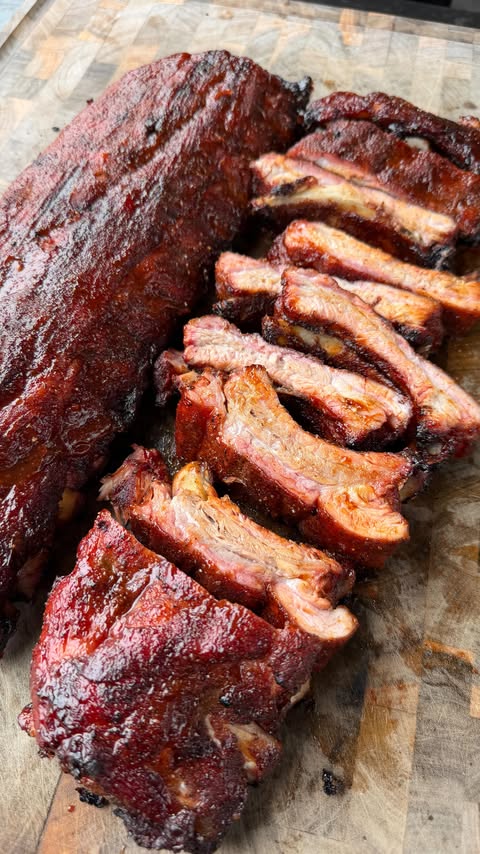 Instagram post by @cooking_with_fire___ for Pit Boss Grills. Caption reads: [...] classic with baby back ribs on the....