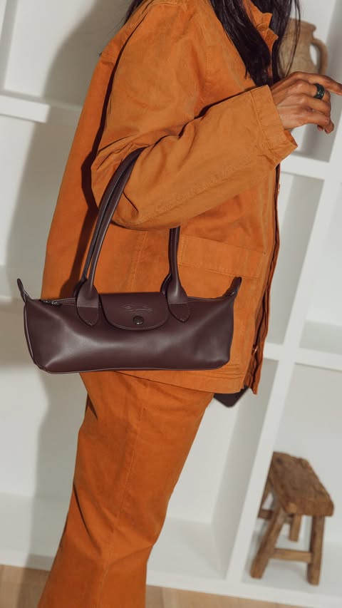 Instagram post by @monikh for LONGCHAMP. Caption reads: Longchamp Le Pliage Xtra M Shoulder Bag, where....
