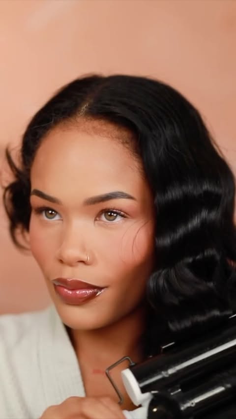 Instagram post by @arnell.armon for IGK Hair. Caption reads: Loving this @IGKHair Good Behavior Smoothing Spray....
