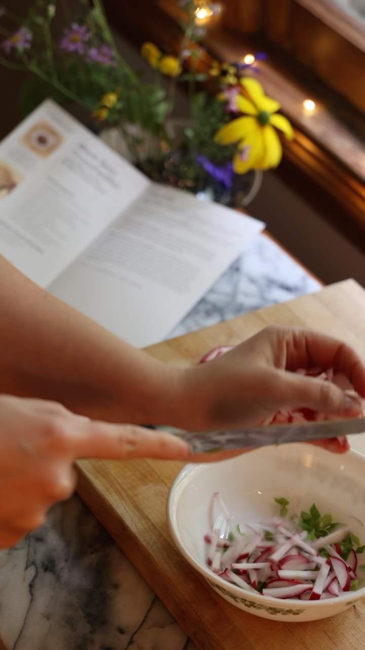 Instagram post by @livingwells_ for Purple Carrot. Caption reads: It’s no secret that food and cooking are major....