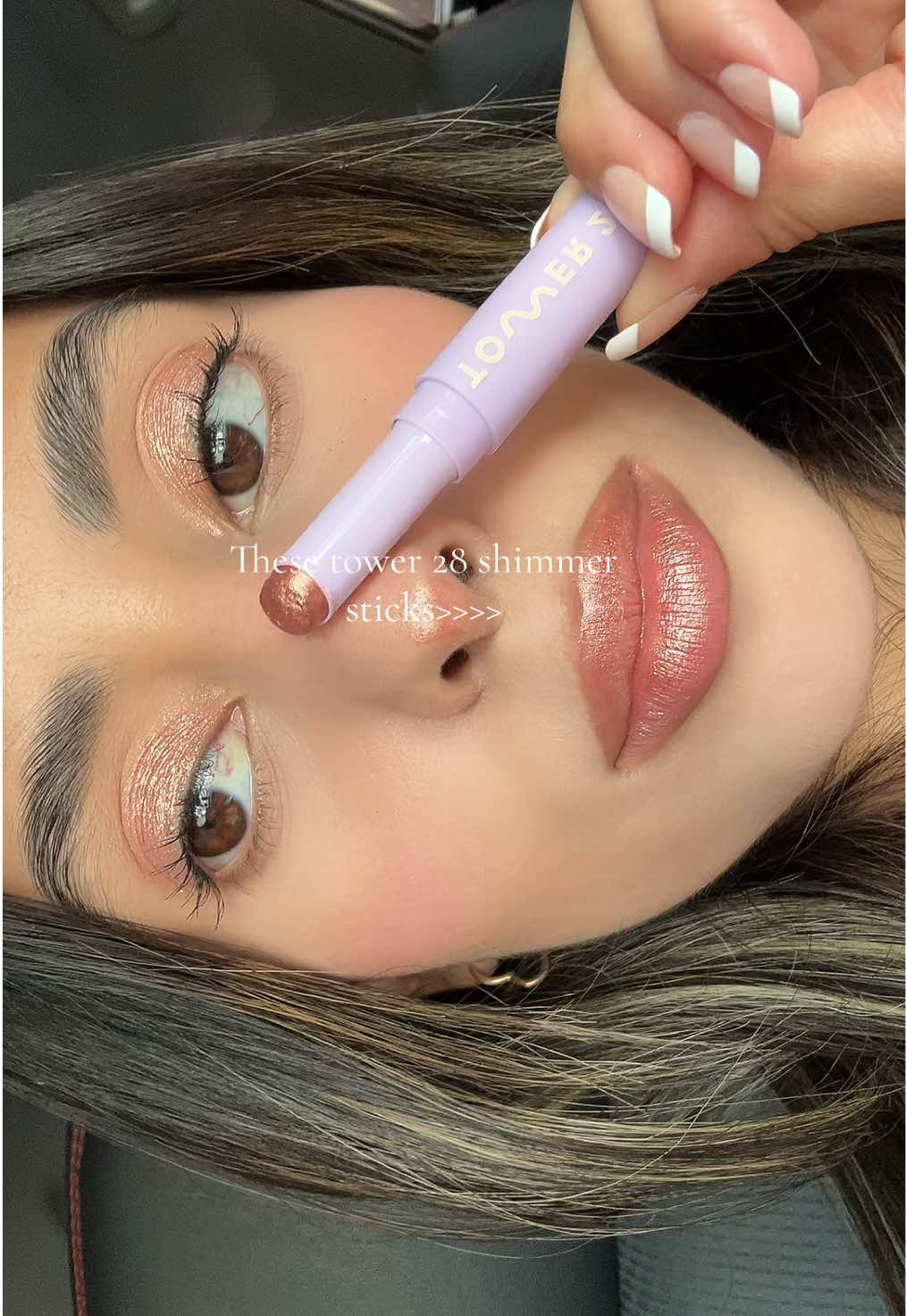 TikTok post by @faabanna for Tower 28 Beauty. Caption reads: @Tower 28 Beauty shimmer stick in the shade [...].