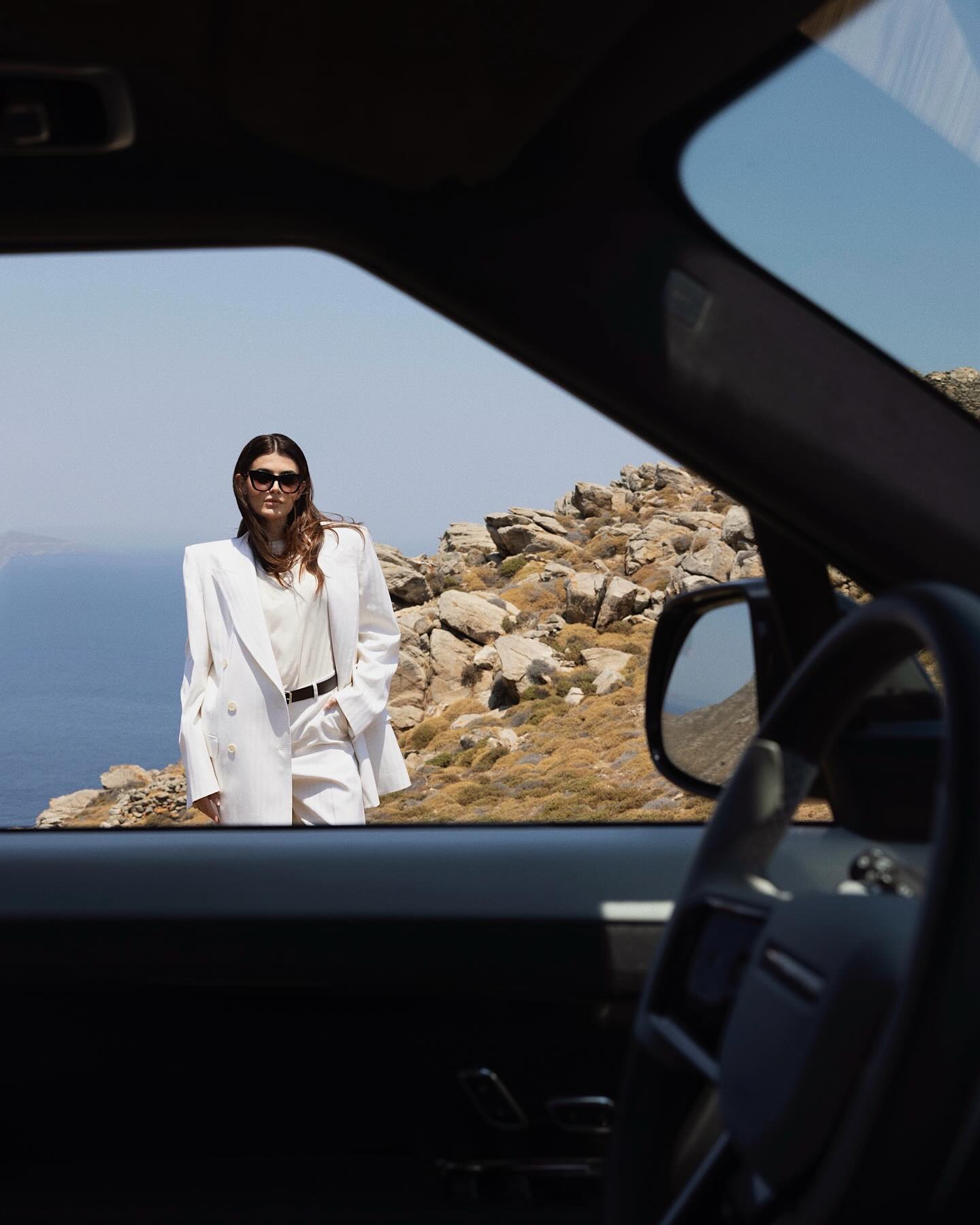 Instagram post by @floradallevacche for Land Rover. Caption reads: Celebrating 55 years of @rangerover in Mykonos,....