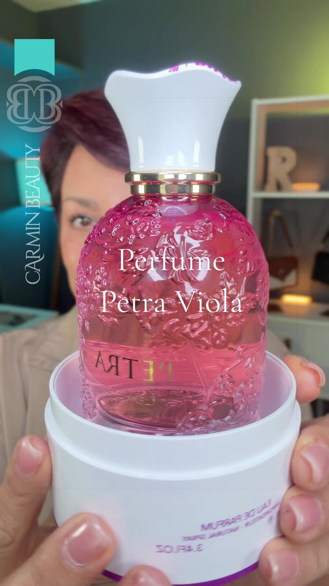 TikTok post by @carmin_beauty for Oudware. Caption reads: @Oudware @LATTAFA USA Petra Viola Eau De [...].