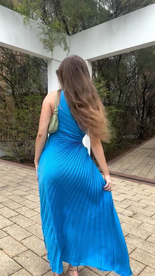 Instagram post by @melzahj for Gingham and Heels. Caption reads: bold blue summer in @ginghamandheels 🦋🌬️ wind....