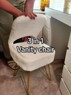 TikTok post by @teddyandhudson for Living and Home. Caption reads: OMG GUYS A vanity chair with hidden storage at....