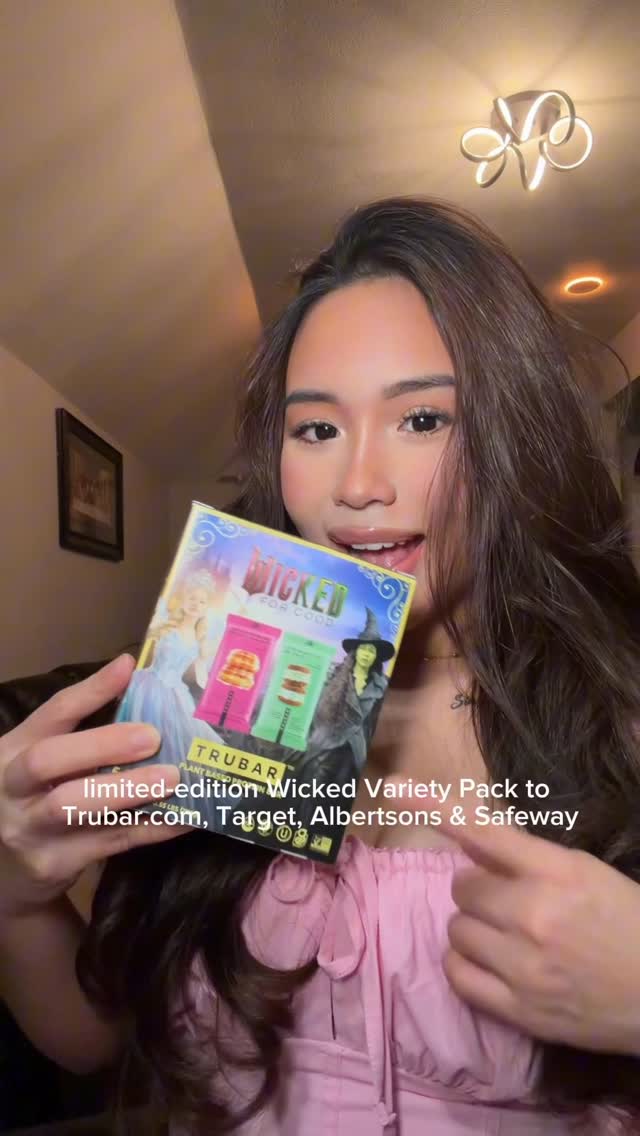 Instagram post by @hannie.skin for TRUBAR. Caption reads: Elphaba or Glinda 💚🩷TRUBAR x Wicked 🩷💚 new....