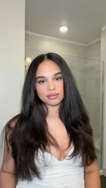 Instagram post by @mariahlovelewis for OGX Beauty. Caption reads: #OGXPartner salon worthy blowout from at home✨ buy....