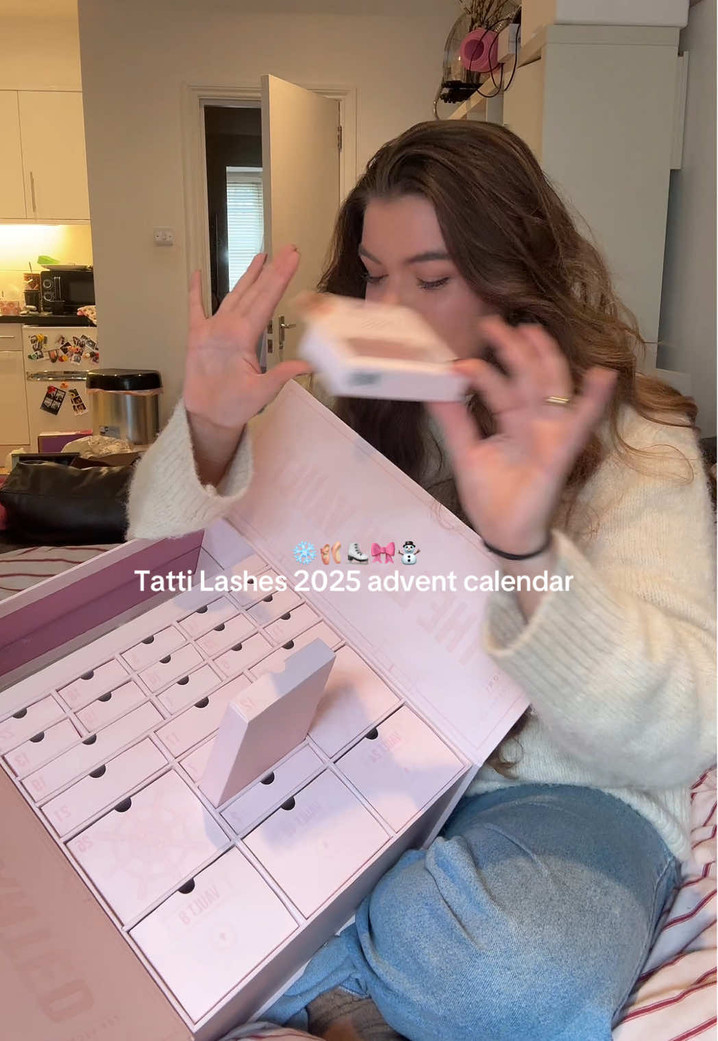TikTok post by @carriependle for TATTI LASHES. Caption reads: It's time!!!🎄 @TATTI LASHES 2025 advent calendar....
