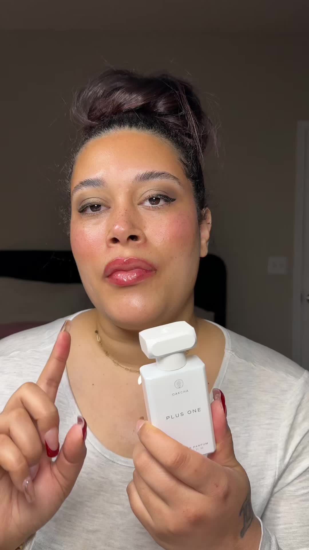 TikTok post by @iamadunniade1 for Oakcha. Caption reads: One spray and you’ll understand the hype @Oakcha....