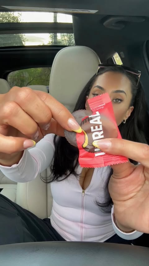 Instagram post by @pilatesbodyraven for UNREAL Snacks. Caption reads: #unrealpartner I hope he doesnt see this buuuuuttt....