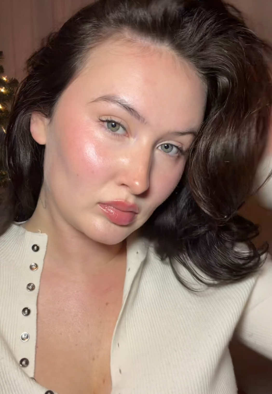 TikTok post by @ellievonthaden for Rhode Skin. Caption reads: The glow from the @rhode skin mist is insane....
